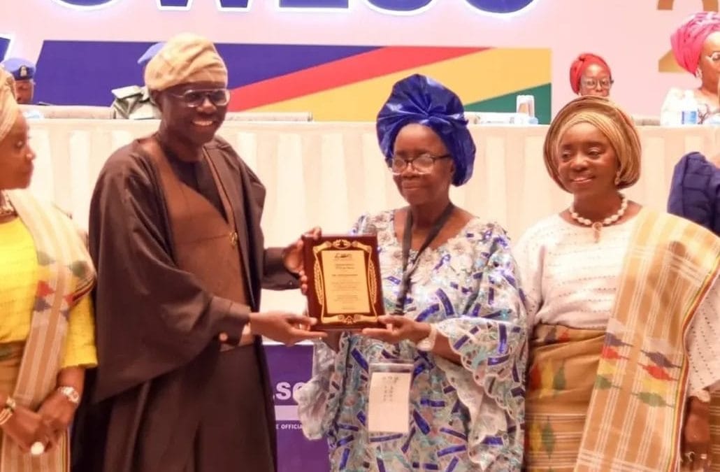 Lagos State Governor presenting award to the Founder Home of God’s Grace for Orphans and Widows